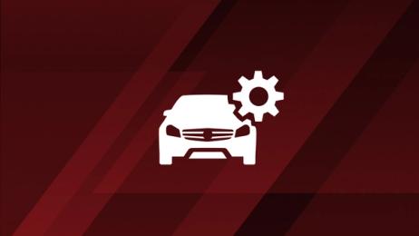 Symbolic AMG vehicle with a symbolic gear in fron of a red striped background.