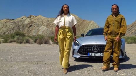 Naomi Schiff and Lewis Hamilton in front of the new Mercedes-AMG GT Coupé