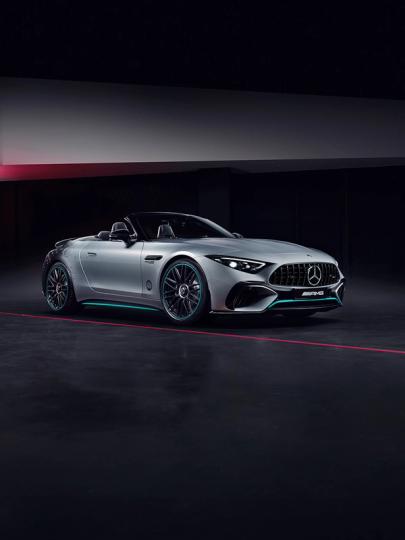 Silver Mercedes-AMG SL 63 with AMG Crest in background