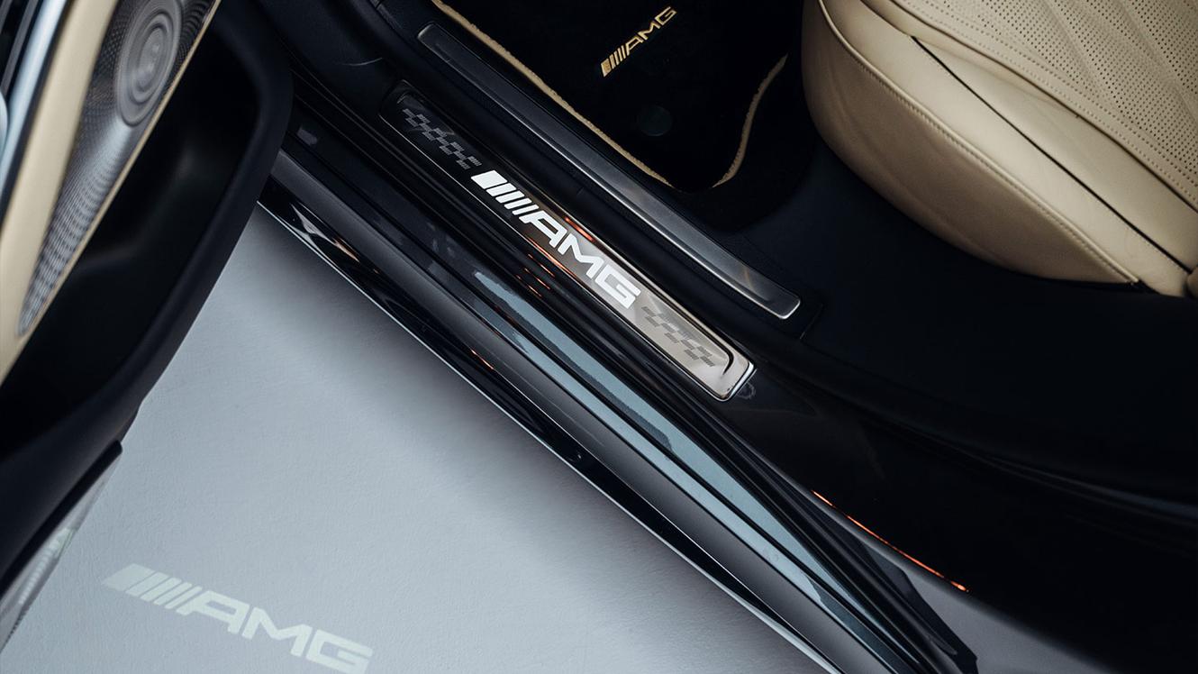 The Mercedes-AMG lettering on a door sill panel.