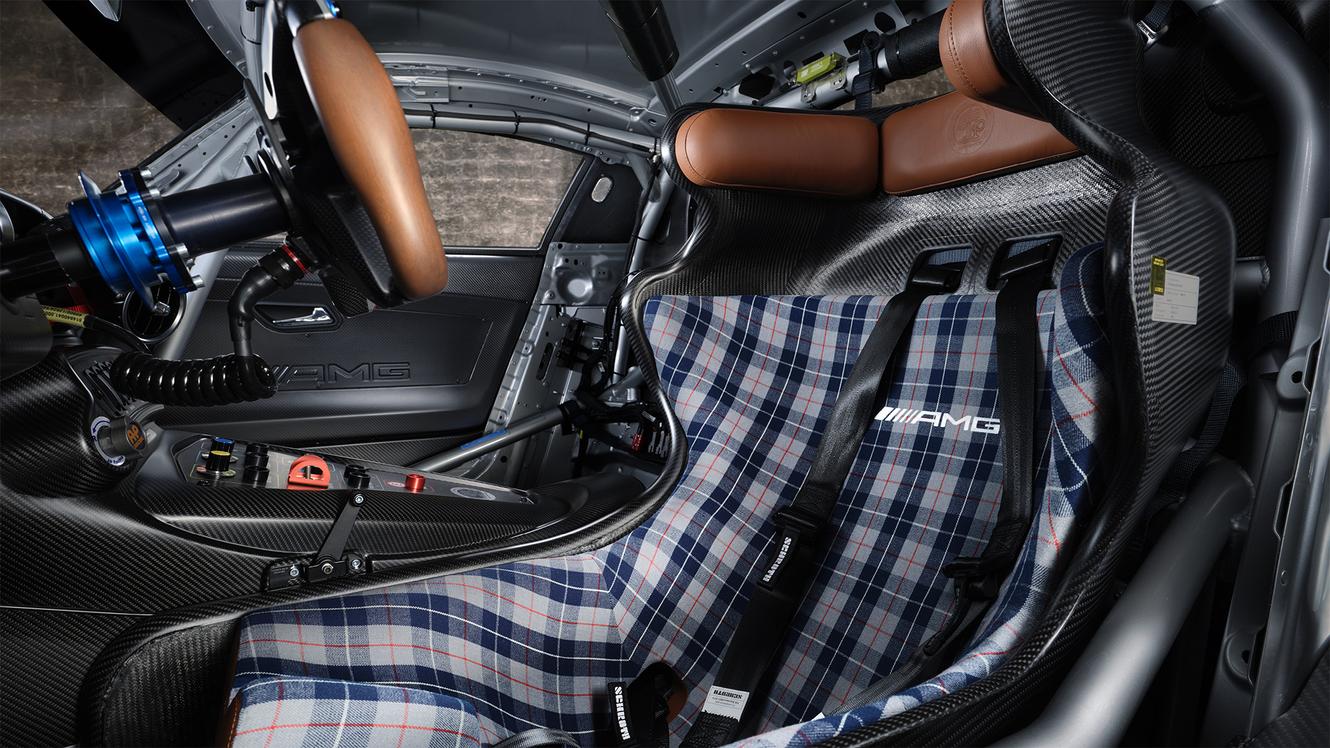 Side view of the interior of the Mercedes-AMG GT3 Edition 130Y Motorsport with steering wheel and driver seat