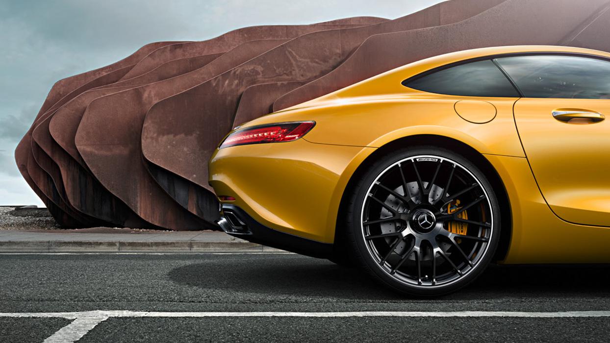 Rear of a yellow Mercedes-AMG in side view