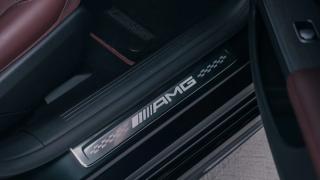 The Mercedes-AMG lettering on a door sill panel.