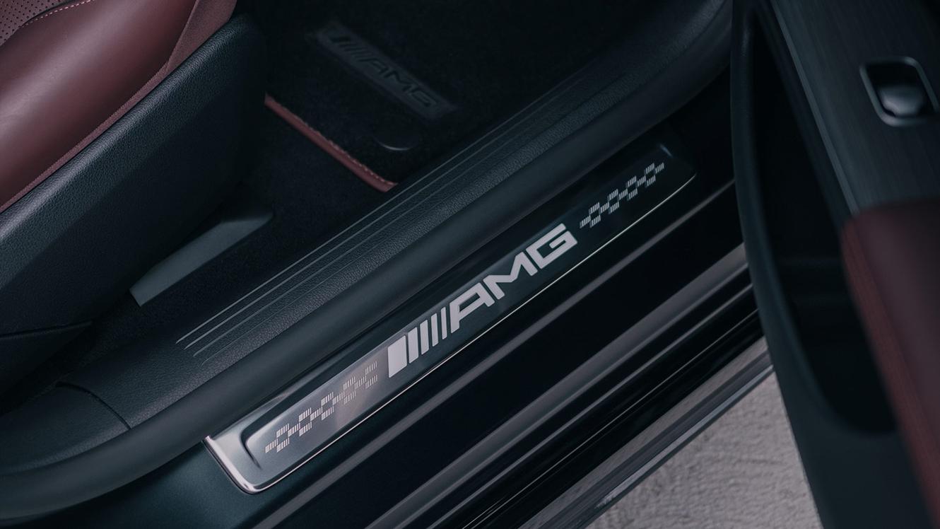 The Mercedes-AMG lettering on a door sill panel.