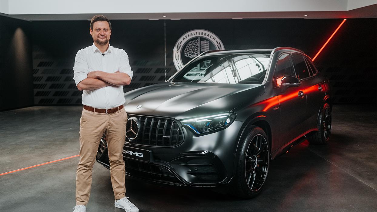 The Product Manager stands in front of the new Mercedes-AMG GLC 63 S E PERFORMANCE.